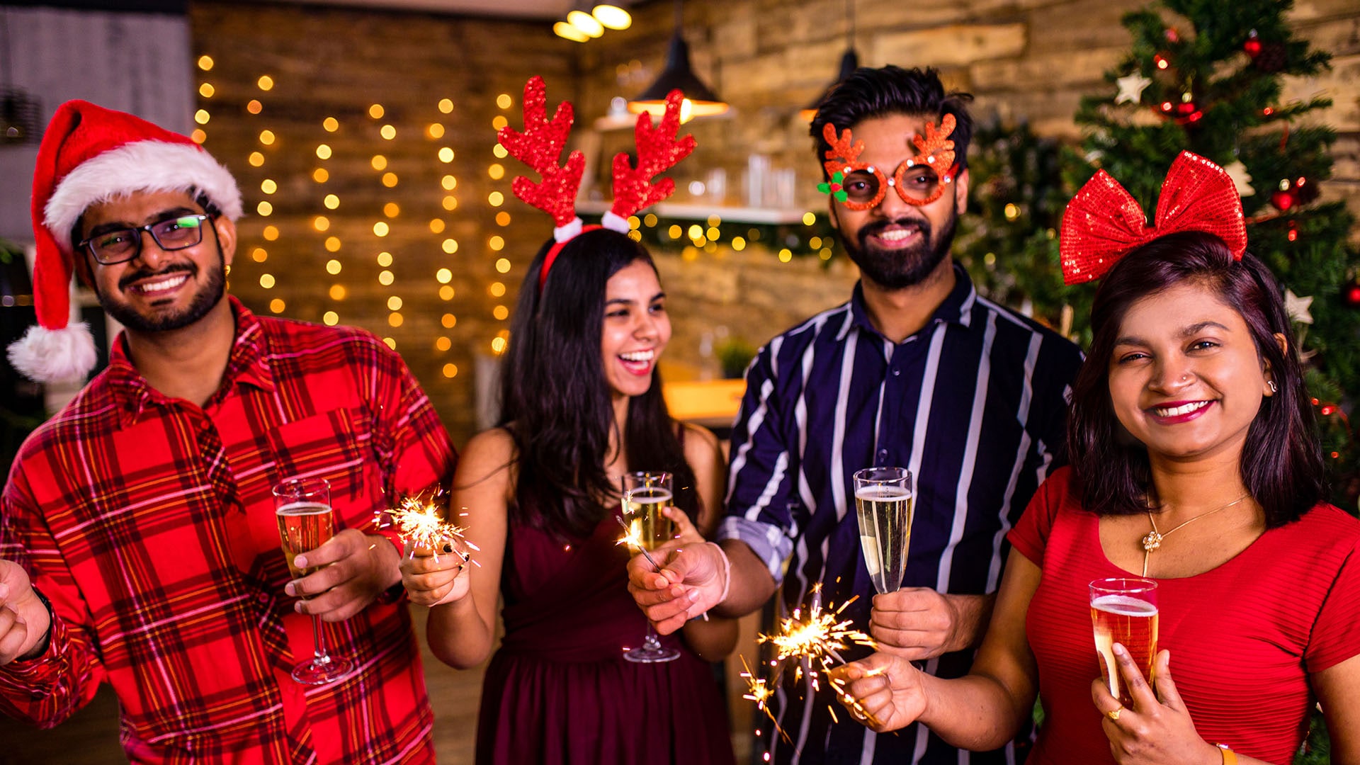 group of four indian friends cheering with champag 2024 10 30 20 19 45 utc min