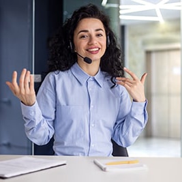 A woman helping someone with technical support online